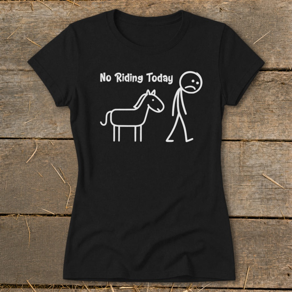 Black t-shirt with white text "No Riding Today" and a sad stick figure beside a horse.