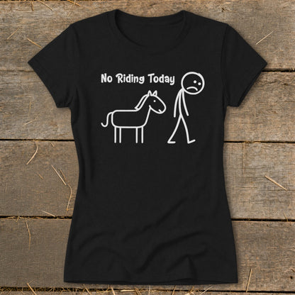 Black t-shirt with white text "No Riding Today" and a sad stick figure beside a horse.