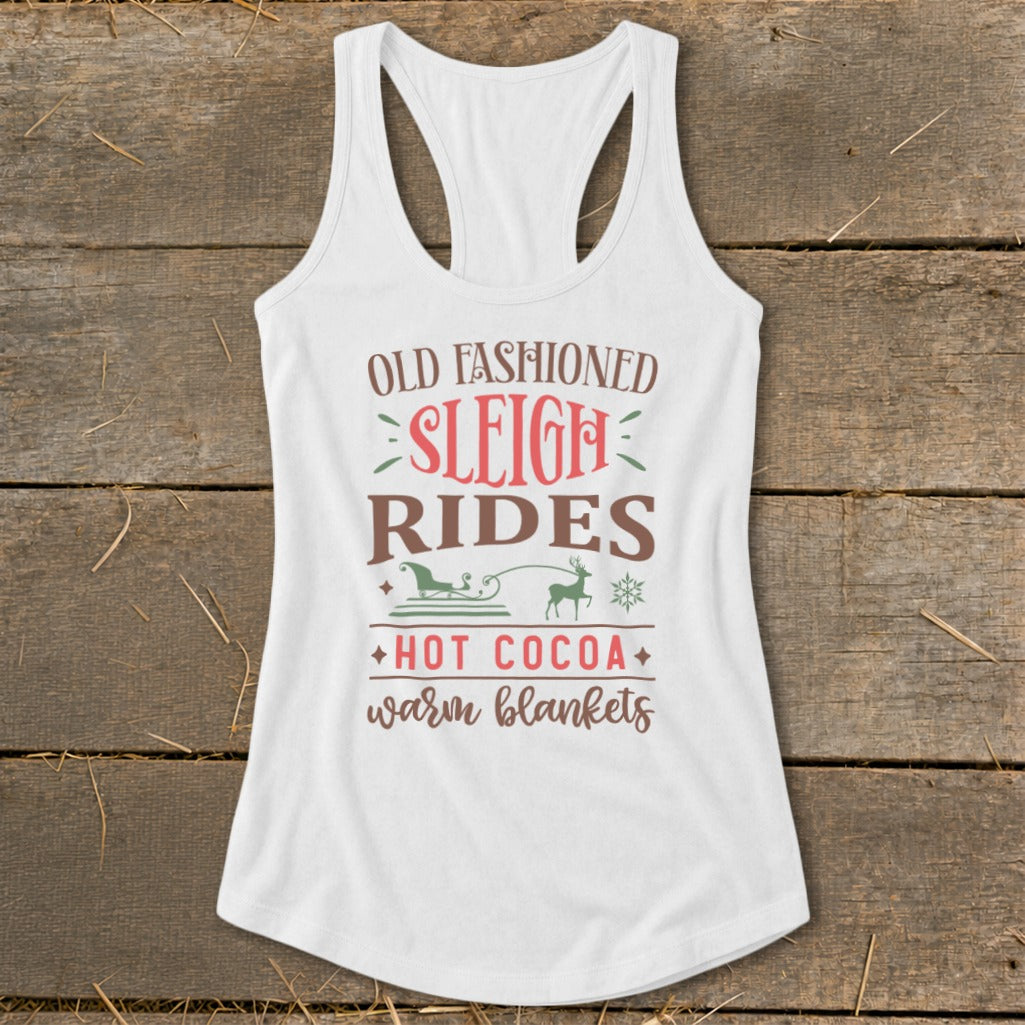 White tank top with "Old Fashioned Sleigh Rides, Hot Cocoa, Warm Blankets" text and graphics.