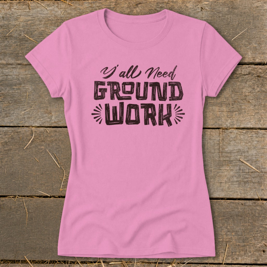 Pink t-shirt with "Y'all Need GROUND WORK" text design.
