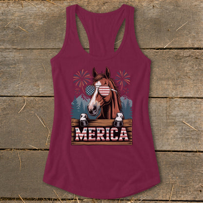 Horse with American flag sunglasses and "MERICA" text on wooden sign.