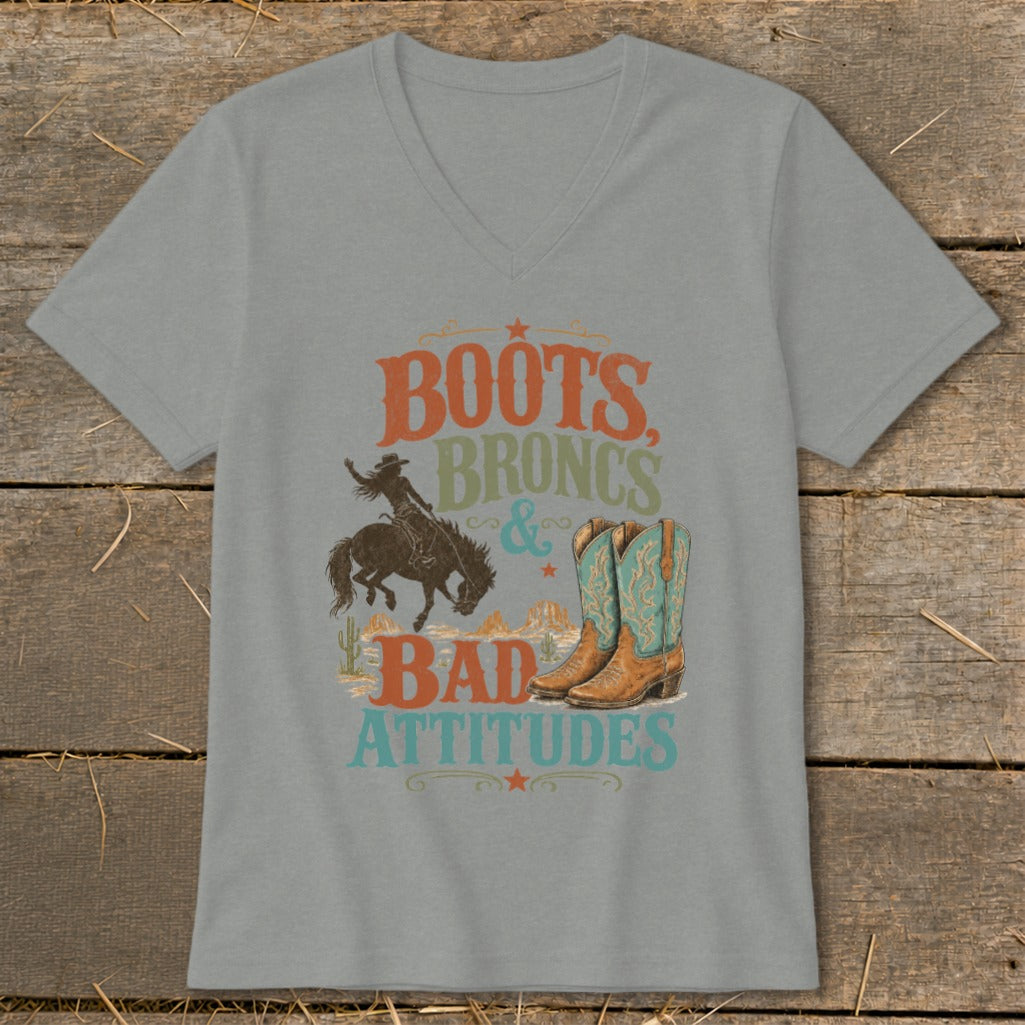 Gray t-shirt with "Boots, Broncs & Bad Attitudes" text, bucking bronco, and cowboy boots.