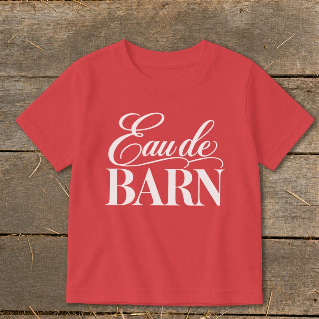 Red t-shirt with white "Eau de BARN" text in script and block font.