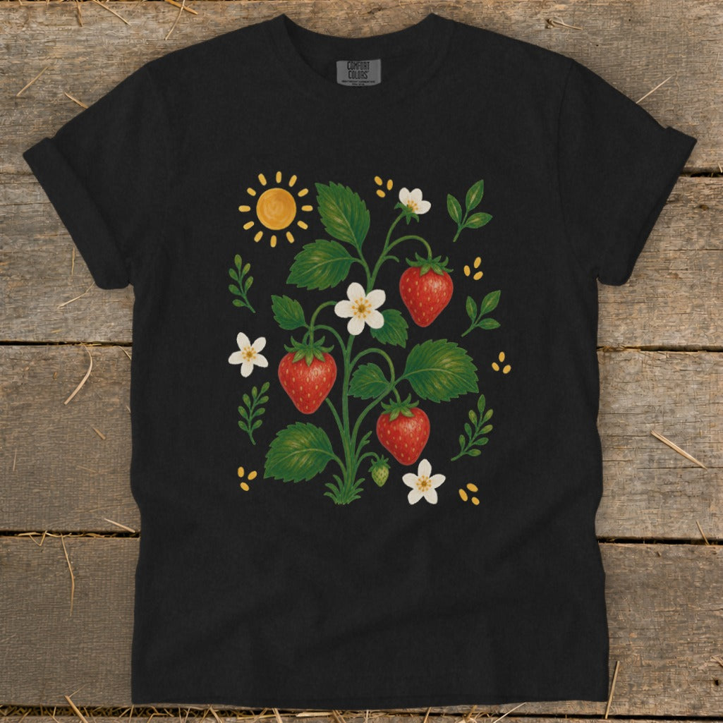 Black t-shirt featuring a strawberry plant illustration with fruit, flowers, and a sun.