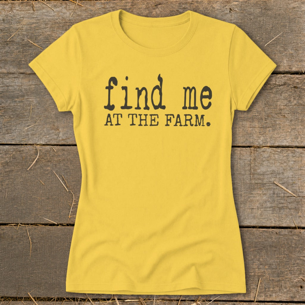 Yellow t-shirt with black text reading "find me AT THE FARM."