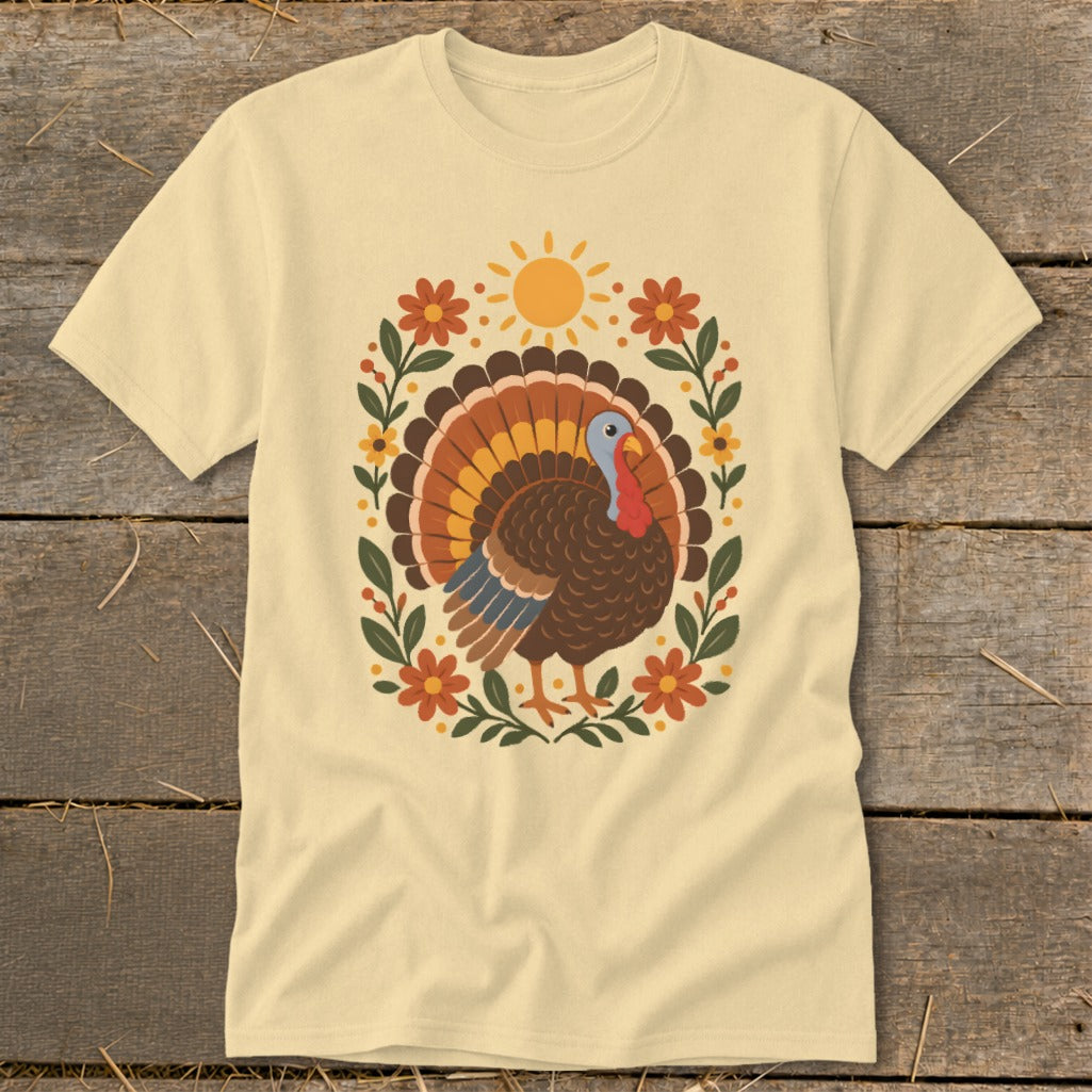 Cream t-shirt with a graphic of a turkey and floral sun design.
