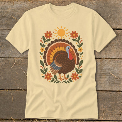 Cream t-shirt with a graphic of a turkey and floral sun design.