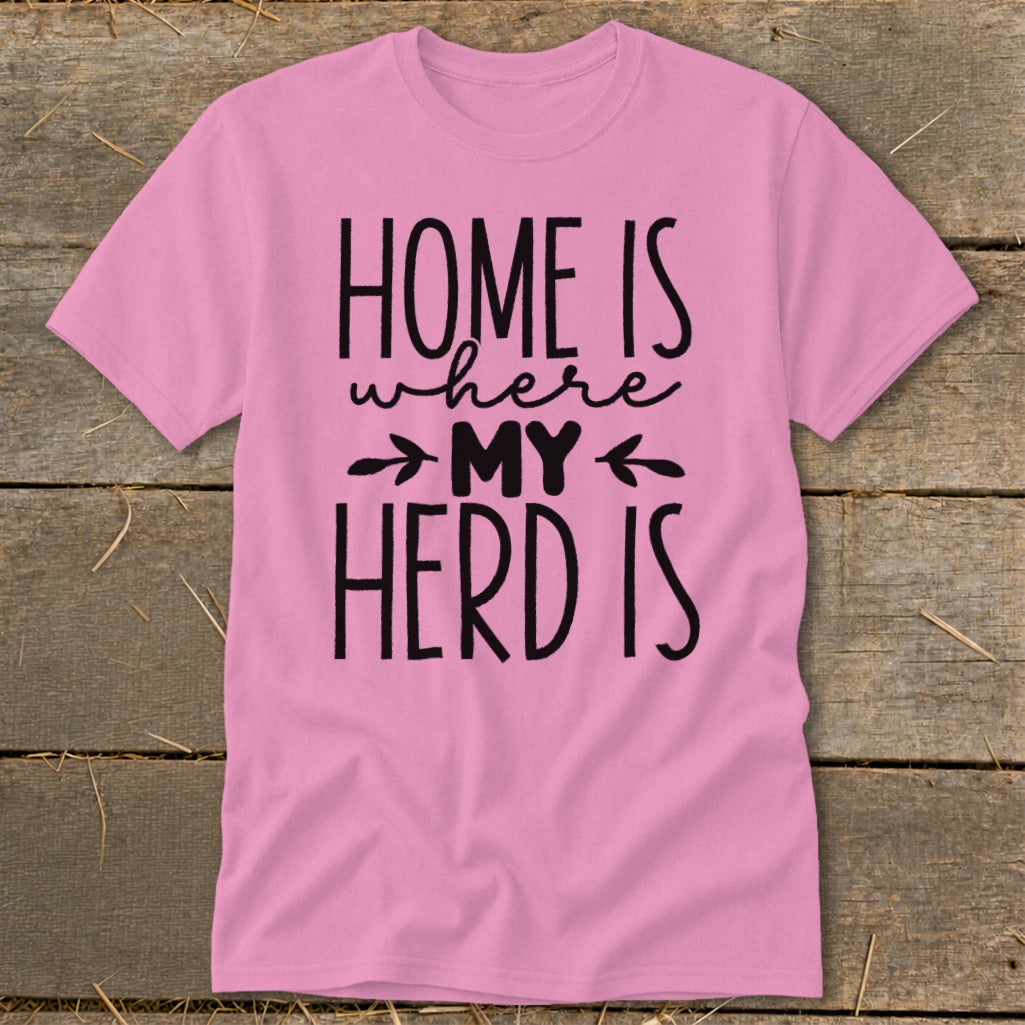 Pink t-shirt with black text that reads "HOME IS where MY HERD IS".