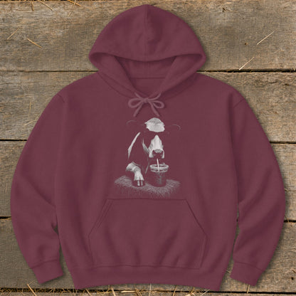 Maroon hoodie with a black and white cow wearing sunglasses drinking from a cup.