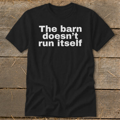 Black t-shirt with white text: "The barn doesn't run itself"