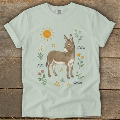Light green t-shirt with a watercolor-style donkey and floral illustration.