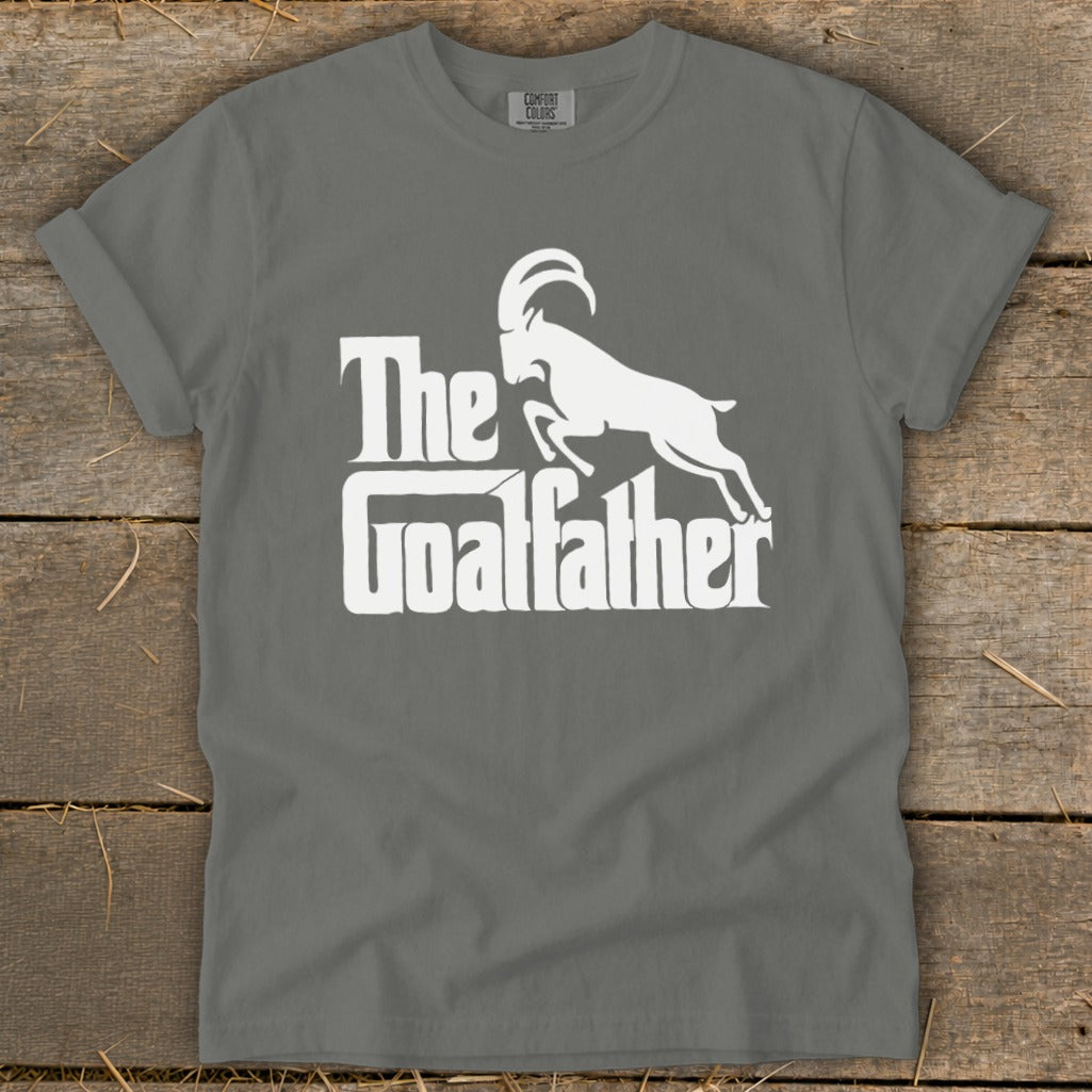Grey t-shirt with white text and graphics: "The Goalfather" and a goat.