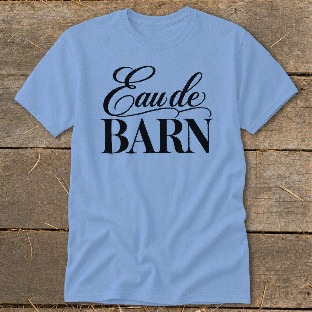 Light blue t-shirt with black "Eau de BARN" text in cursive and block letters.