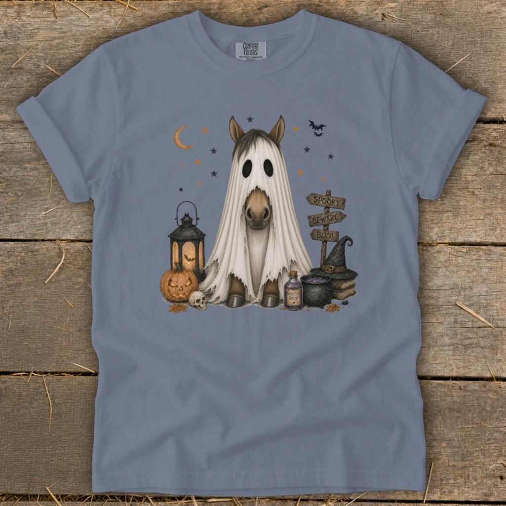 Horse in a ghost costume surrounded by Halloween decorations and signs.