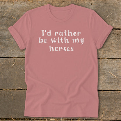 Pink t-shirt with white text that reads "I'd rather be with my horses."