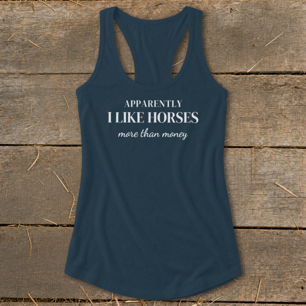 Dark blue tank top with white text: "APPARENTLY I LIKE HORSES more than money"