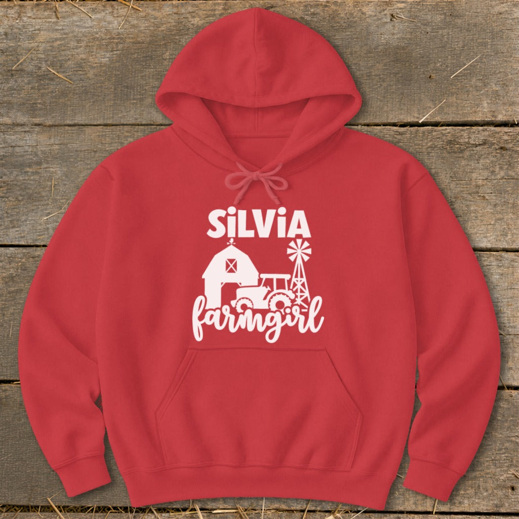 Red hoodie with white text and graphic: SILVIA farmgirl with barn, tractor, and windmill.