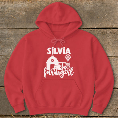 Red hoodie with white text and graphic: SILVIA farmgirl with barn, tractor, and windmill.