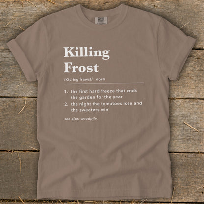 Brown t-shirt featuring dictionary-style text defining "Killing Frost" with a humorous second definition.