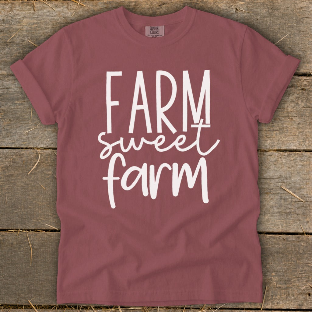 Maroon t-shirt with white "FARM sweet farm" graphic design.