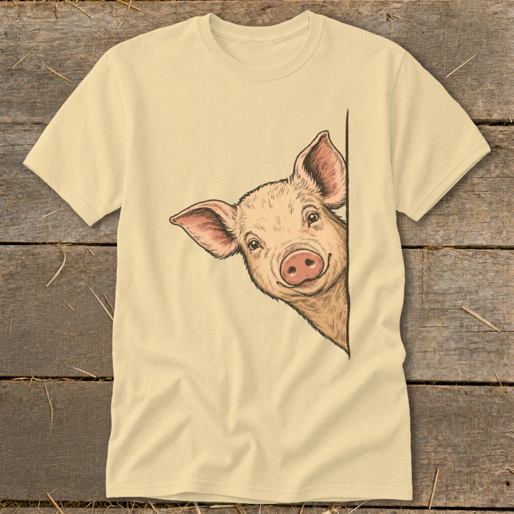 Light yellow t-shirt with a hand-drawn illustration of a pig peeking from the side.