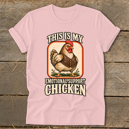 Pink t-shirt with a chicken wearing a vest, reading "This is my emotional support chicken."