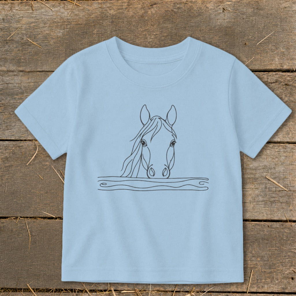 Light blue t-shirt with black line drawing of a horse's head peeking over wavy lines.