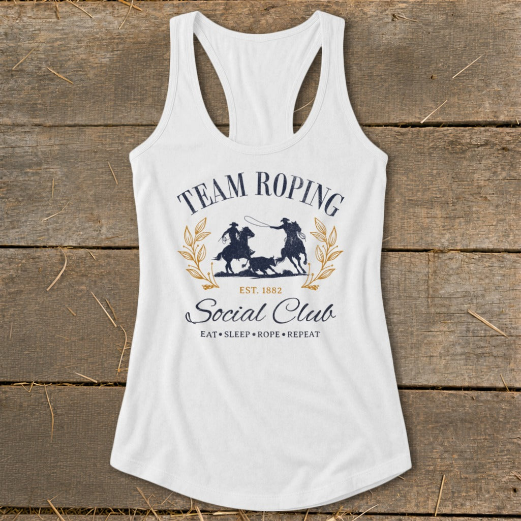 White tank top with "Team Roping Social Club" graphic and cowboy silhouettes.