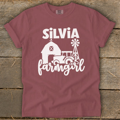 T-shirt with "Silvia farmgirl" text and farm graphics in white.