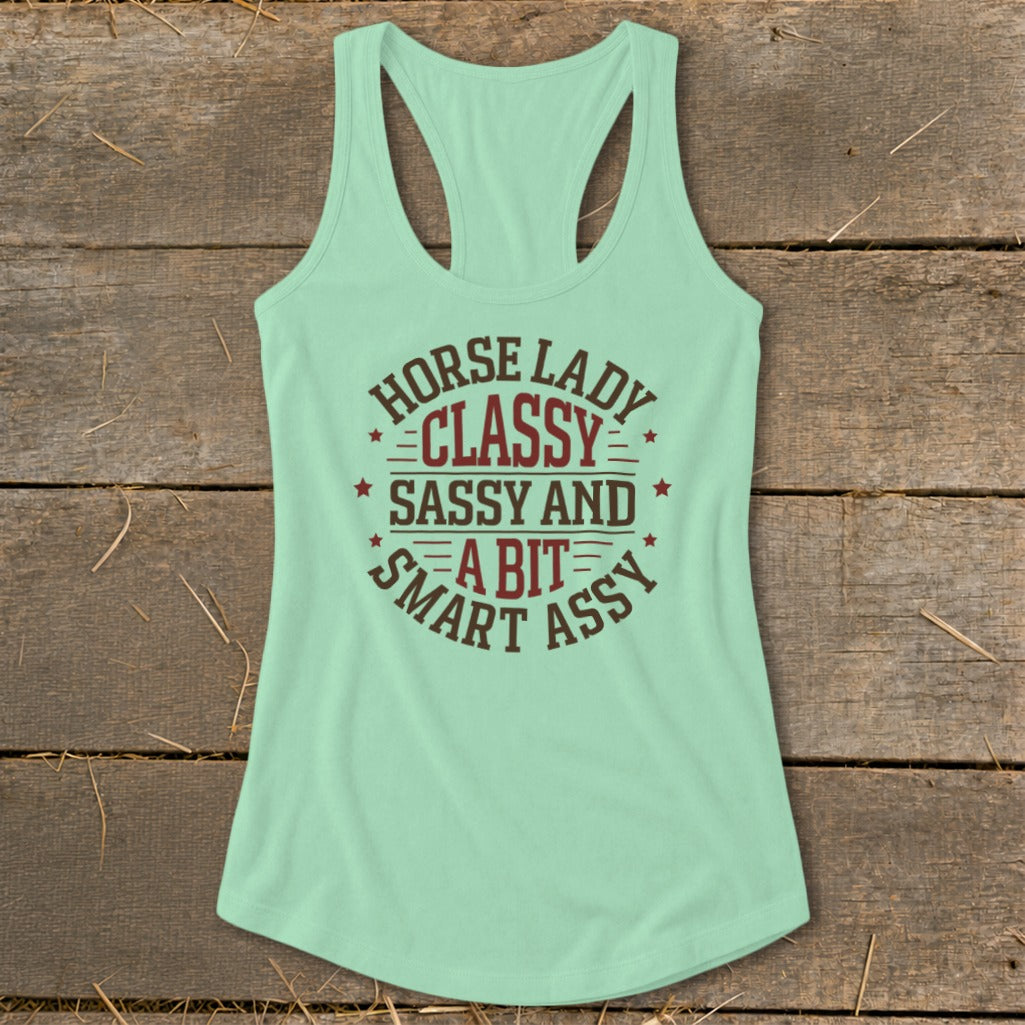Pale green racerback tank top with "Horse Lady Classy Sassy and A Bit Smart Assy" text.