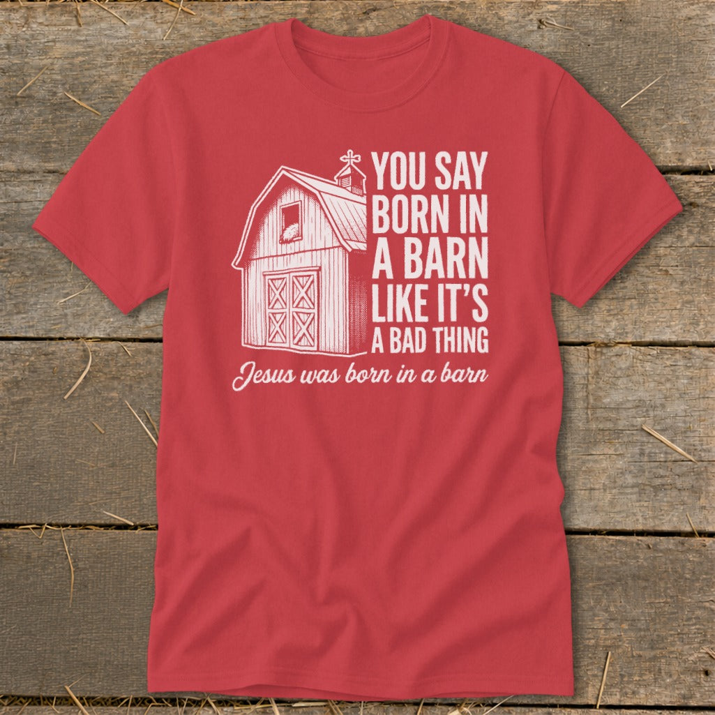 Red t-shirt with barn graphic and text about Jesus being born in a barn.