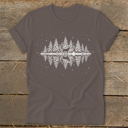 Brown t-shirt with a white graphic of a deer in a snowy forest reflected in water.