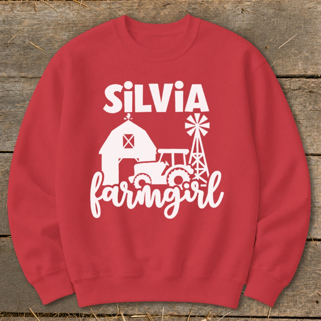 Red sweatshirt with white text and farm graphics, including "SILVIA farmgirl".