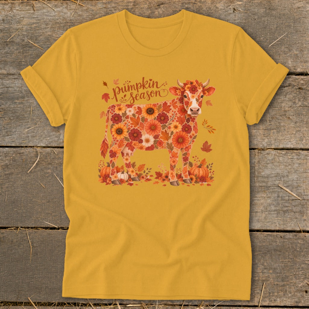Yellow t-shirt featuring a cow made of autumn flowers and the text "pumpkin season."