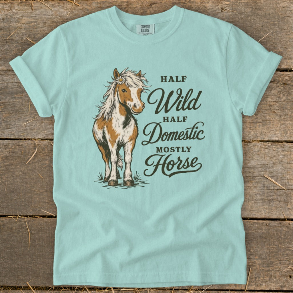 Light blue t-shirt with a horse graphic and text reading "Half Wild Half Domestic Mostly Horse".