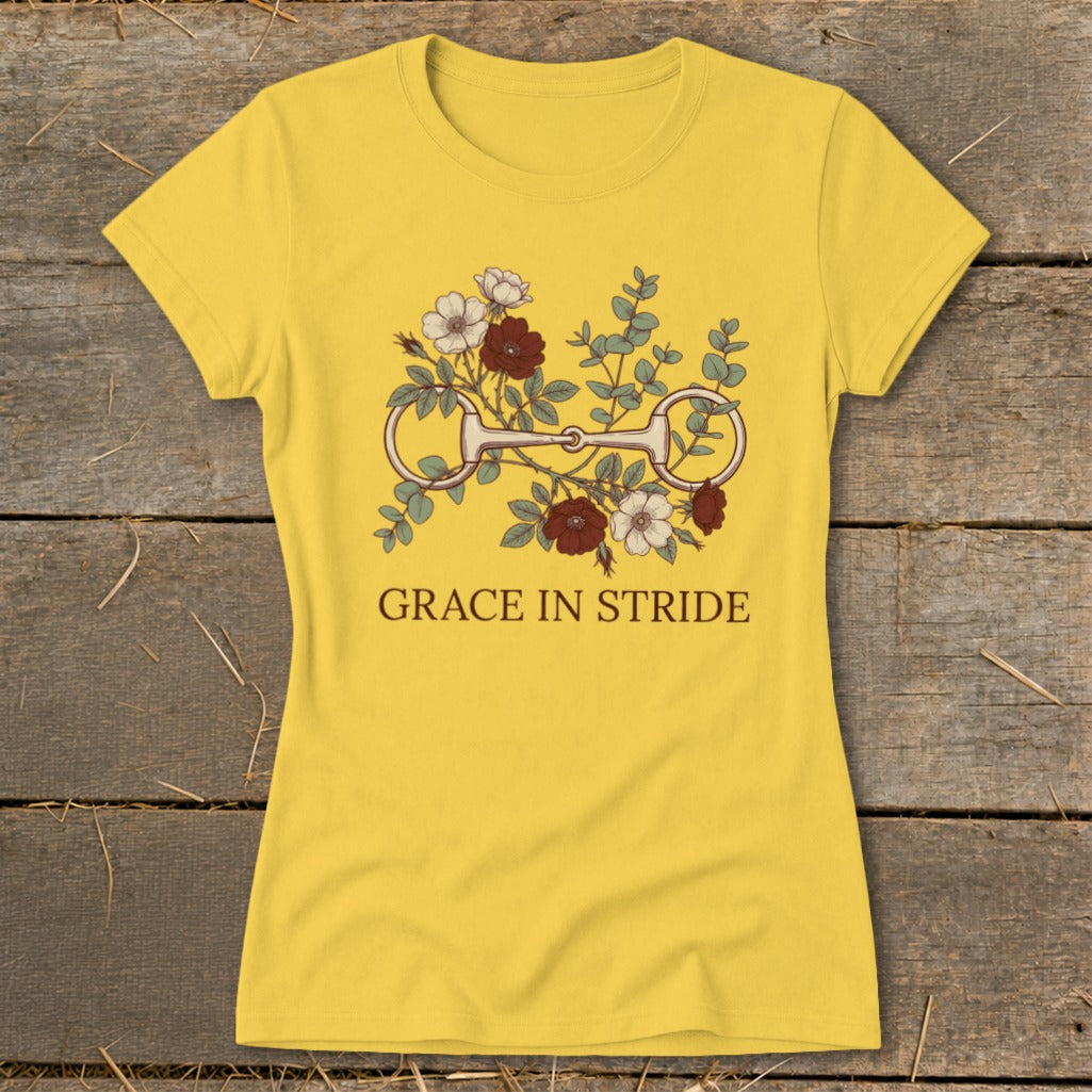 Yellow t-shirt with horse bit and floral graphic, text "GRACE IN STRIDE".