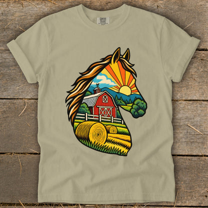 An olive green t-shirt featuring a graphic of a horse head silhouette filled with a farm scene, red barn, and hay bales.