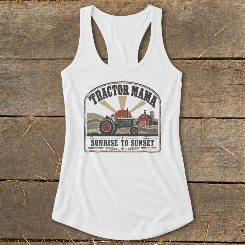 White tank top with "Tractor Mama Sunrise to Sunset" graphic featuring a tractor and barn.