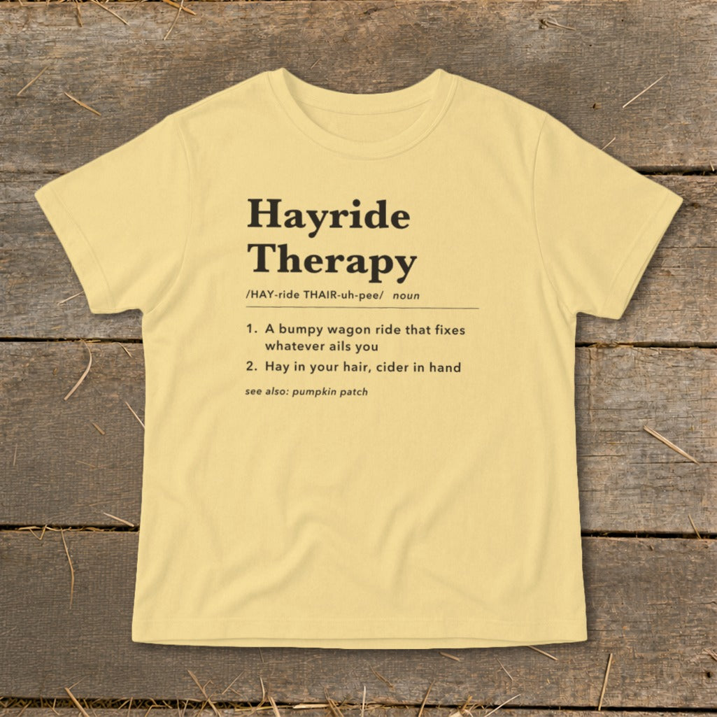 Yellow t-shirt with "Hayride Therapy" definition and see also: pumpkin patch.