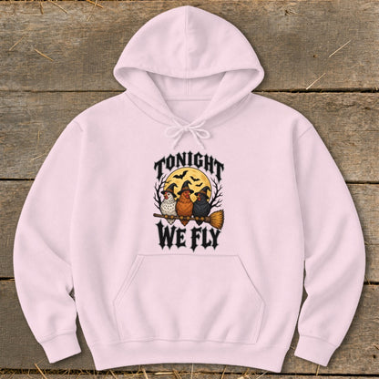 Pink hoodie with "Tonight We Fly" text and three chickens on a broomstick.