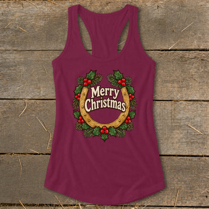 Maroon tank top with a horseshoe and holly wreath graphic saying "Merry Christmas."