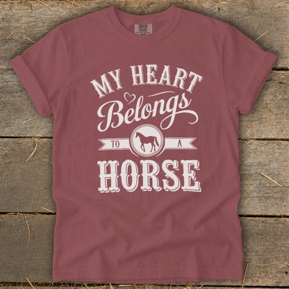 Maroon t-shirt with "My Heart Belongs To A Horse" text and horse graphic.