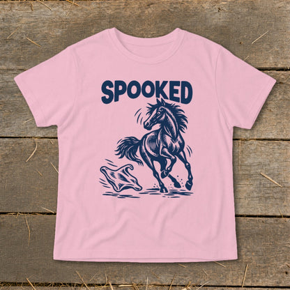 Pink t-shirt with navy "SPOOKED" text, horse, and ghost graphic.