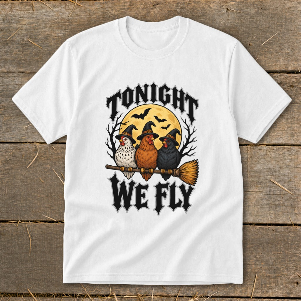 White t-shirt with three chickens in witch hats on a broomstick with text "Tonight We Fly".