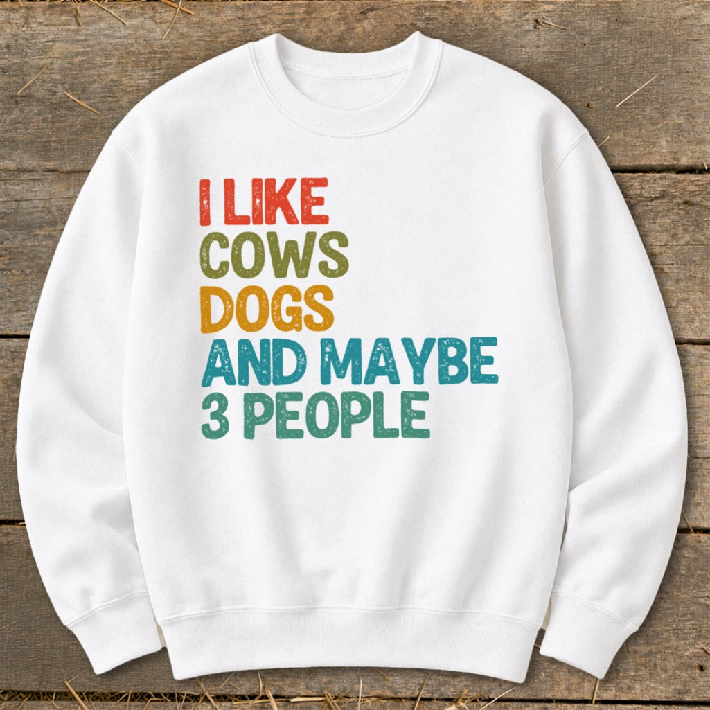 White sweatshirt with "I Like Cows Dogs and Maybe 3 People" text.