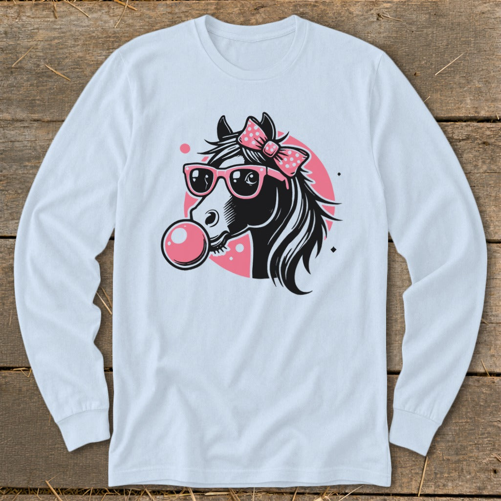 Black horse head with pink bow, sunglasses, and bubblegum on a light blue long sleeve shirt.