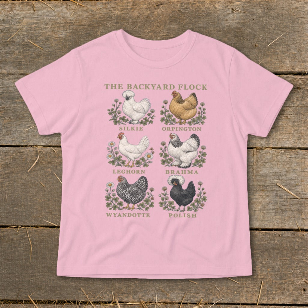 Pink t-shirt with "The Backyard Flock" and six illustrated chicken breeds: Silkie, Orpington, Leghorn, Brahma, Wyandotte, Polish.