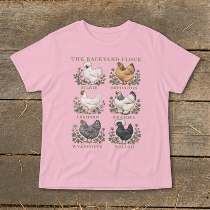Pink t-shirt with "The Backyard Flock" and six illustrated chicken breeds: Silkie, Orpington, Leghorn, Brahma, Wyandotte, Polish.