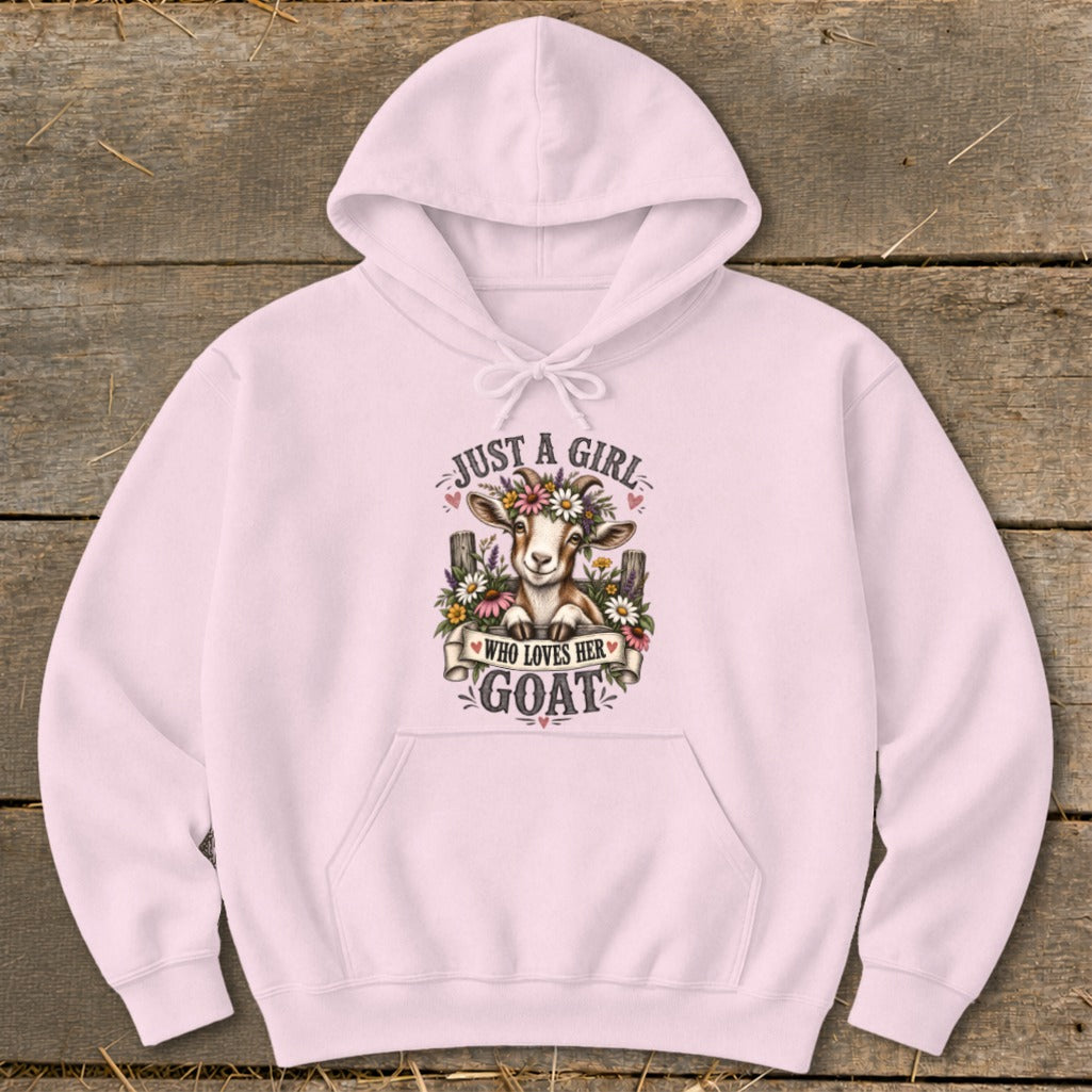 Pink hoodie with a graphic of a goat wearing a flower crown, text reads "Just a girl who loves her goat".