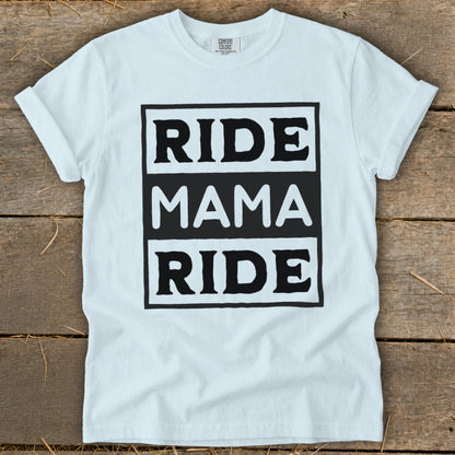 White t-shirt with "RIDE MAMA RIDE" text in black boxes.